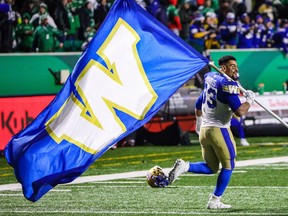 Winnipeg Blue Bombers tailback Andrew Harris celebrates his team's 20-13 victory over the host Saskatchewan Roughriders in the CFL's West Division final on Nov. 17.