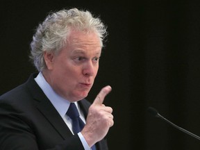 Former Quebec Premier Jean Charest speaks on energy and resources to a luncheon gathering of the Chamber of Commerce in Winnipeg on March 4, 2015.