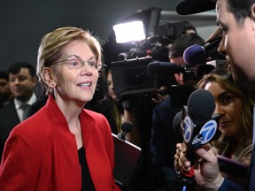 Democratic presidential hopeful Massachusetts Senator Elizabeth Warren speaks to the press in the spin room after the sixth Democratic primary debate of the 2020 presidential campaign season co-hosted by PBS NewsHour & Politico at Loyola Marymount University in Los Angeles, California on December 19, 2019.