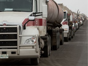 Fuel trucks wait along the side of Fleet Street in Regina, Saskatchewan on Dec. 12, 2019. Unifor workers, who are currently locked out of the Co-op Refinery Complex, are disrupting the flow of traffic in and out of the complex. BRANDON HARDER/ Regina Leader-Post