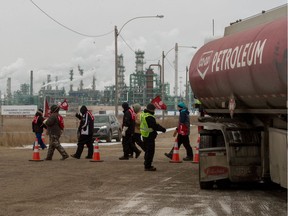 Unifor workers, who are currently locked out of the Co-op Refinery Complex, picket at the site in December.