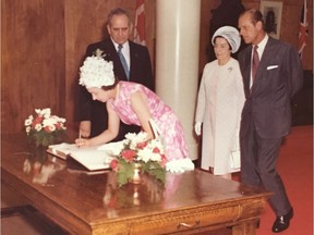 Former Regina mayor Harry Walker, standing left, and his wife, Marg (standing in white), are shown with Queen Elizabeth II and Prince Philip at Regina City Hall in the early 1970s. Harry Walker was the mayor of Regina at the time.