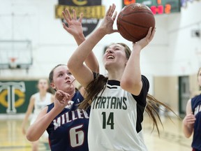 Campbell Tartans forward Fynlea Carter (14) takes a shot in front of Miller Marauders post Maryn Casemore during the Hardwood Classic junior basketball tournament at Campbell Collegiate on Dec. 13, 2019.