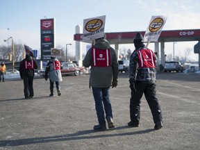 Locked-out workers from Regina's Co-op Refinery Complex picket at the Co-op fuel station of the corner of Park Street and Dewdney Avenue in Regina on Tuesday, December 17, 2019.