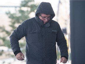 Gioulian Nikdima walks into Court of Queen's Bench on Victoria Avenue in Regina, Saskatchewan on Dec. 18, 2019.