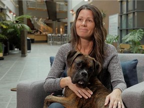 Colleen Dell sits with dog E-Jay. Dell is a professor of sociology at the University of Saskatchewan. She, along with Darlene Chalmers, an associate professor of social work at the University of Regina based in Saskatoon and in collaboration with Correctional Services Canada (CSC) and the CSC's Citizens Advisory Committee, recently released a magazine called Animal Memories, which is an exploration of research (including their own) on the impact of the human-animal bond on inmates across Canada. Photo supplied by the University of Regina.