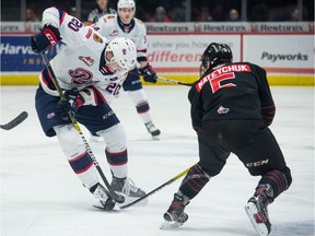 REGINA, SASK : December 28, 2019  -- The Regina Pats' Kyle Walker steps on the stick of the Moose Jaw Warriors' Denton Mateychuk (5) during a WHL hockey game at the Brandt Centre in Regina, Saskatchewan on Dec. 28, 2019. BRANDON HARDER/ Regina Leader-Post