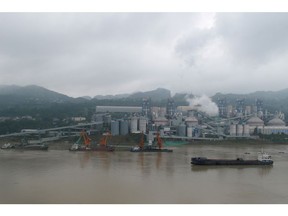 A cement plant is seen by the Yangtze river near Fuling county in Chongqing, China, October 15, 2019.  
REUTERS/David Stanway/File Photo