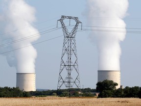 The cooling towers and high-tension electrical power lines are seen near the Golfech nuclear plant on the border of the Garonne River between Agen and Toulouse, France, August 29, 2019.