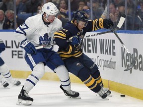CP-Web. Toronto Maple Leafs center Adam Brooks, left, and Buffalo Sabres center Kyle Criscuolo skate the puck into the boards during the second period of an NHL preseason hockey game in Buffalo, N.Y., Saturday, Sept. 22, 2018.