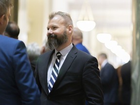 Saskatchewan's Minister of Environment is questioning what's changed in the federal government's calculations that will lead to lower carbon tax rebates for residents in the New Year. Minister of Environment Dustin Duncan attends the first day of the provincial fall legislative session at the Legislative Building, in Regina on Wednesday, Oct. 23, 2019.