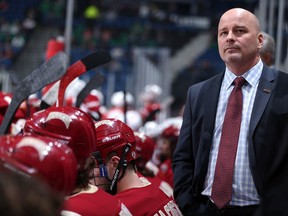 MINNEAPOLIS, MN - MARCH 20:  University of Denver head coach Jim Montgomery looks on as his team takes on Miami of Ohio during the National Collegiate Hockey Conference Frozen Faceoff Conference Championship at Target Center on March 20, 2015 in Minneapolis, Minnesota.  NOTE TO USER:  Mandatory Copyright Notice: Copyright 2015 David Sherman Photography