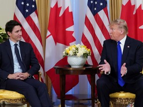 U.S. President Donald Trump and Canada's Prime Minister Justin Trudeau hold a meeting ahead of the NATO summit in Watford, in London, Britain, December 3, 2019.