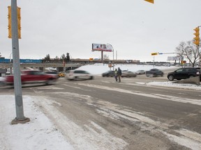 Vehicles travel along Saskatchewan Drive where it intersects with Albert Street.