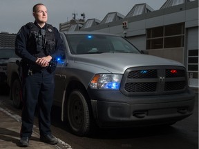 Const. Mike “Hawkeye” Seel of the Regina Police Service stands next to his unmarked police truck in front of police headquarters on Osler Street in Regina, Saskatchewan on Jan. 3, 2020.