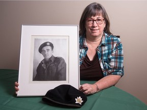 Janet Robinson sits with a photograph of her father Cecil Peeler in her Regina, Saskatchewan home on Jan 4, 2020. Peeler was part of the Canadian 8th Reconnaissance Regiment during the Second World War. Now Robinson is participating in a Dutch liberation pilgrimage for those whose relatives were involved in the Dutch liberation during the Second World War.