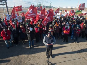 Unifor 594 president Kevin Bittman, centre, speaks during a Unifor rally being held outside the Co-op Refinery Complex on Fleet Street in Regina, saskatchewan on Jan. 7, 2020.