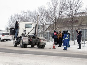 An upset truck drive voices his displeasure with locked out Unifor members that blocked off the Sherwood Co-op gas bar and Home Centre on Winnipeg Street and 9th Avenue North in Regina on Thursday, January 16, 2020.