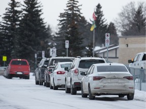 Vehicles line up in front of St. Marguerite Bourgeoys School on Shooter Drive in Regina, Saskatchewan on Jan. 16, 2020.