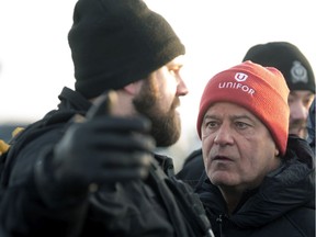 Unifor National President Jerry Dias speaks with the Regina Police Service on the picket line on day 46 of the lock out by Federated Co-operatives Limited (FCL) in Regina on Jan. 20, 2020.