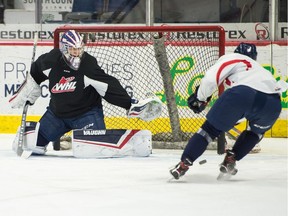 Regina Pats goaltender Donovan Buskey makes a save during practice at the Brandt Centre.