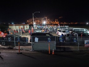 Unifor pickets work the night shift at a barricaded gate to the Co-op Refinery in Regina, Saskatchewan on January 22, 2020.