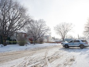A police vehicle sits in front of a home where a death investigation is being carried out on Wascana Street in Regina, Saskatchewan on Jan. 24, 2020.