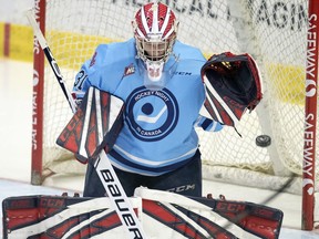 Regina Pats goalie Danton Belluk can't stop a shot by Oliver Okuliar of the Lethbridge Hurricanes during WHL action at the Brandt Centre on Friday.