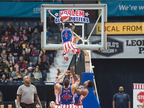 The Harlem Globetrotters' Jahmani (Hot Shot) Swanson is thrown into the air for a dunk during a performance at the Brandt Centre on Tuesday.