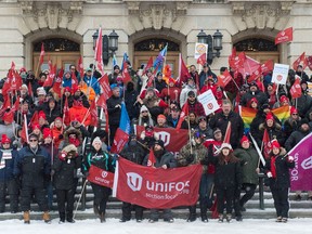 Unifor pickets work the night shift at a barricaded gate to the Co-op Refinery in Regina, Saskatchewan on Jan. 22, 2020.