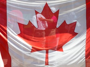 The Canadian flag on Parliament Hill a year ago on Canada Day 2019.