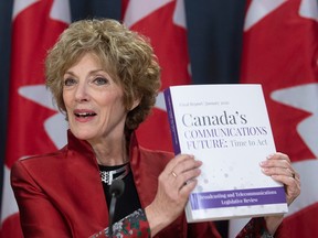 Janet Yale Chair of the Broadcasting and Telecommunications Legislative Review panel holds a copy of the report during a news conference in Ottawa on Jan. 29, 2020.