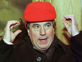 FILE PHOTO: Terry Jones, one of the original Monty Python British comedy troupe members, tries to adjust a winter hat that is just a little bit too small for his head in Aspen.