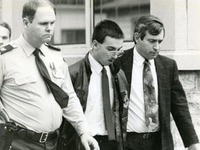 Jason Shawn Cofell is shown in handcuffs outside the Chatham courtroom in 1992 during his trial on three murders that rocked Chatham and Southwestern Ontario. He was convicted of killing Jasen Pangburn and Pangburn's grandparents, Alfred and Virginia Critchley. (London Free Press files)