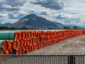 Steel pipe to be used in the construction of the Trans Mountain expansion project lies at a stockpile site in Kamloops, British Columbia.