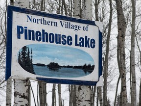 A sign for the Northern Village of Pinehouse Lake.