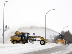 Crews work on clearing snow from streets in the cities south end on Friday, January 17, 2020.