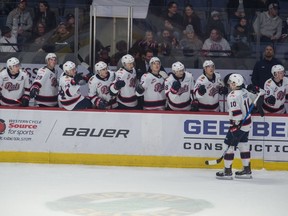 Regina Pats captain Austin Pratt high-fives his teammates after scoring a goal Friday in his 300th WHL game.