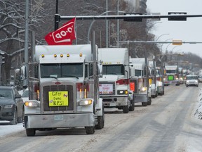 A convoy of Co-op trucks make their way through the downtown on Thursday, Feb. 6, 2020.