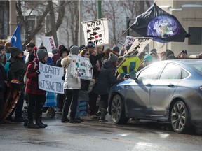 A motorist tries to drive through the line at the "All Out For Wet'suwet'en" protest that blocked the bridge on Albert Street in Regina, Saskatchewan on Feb. 8, 2020.