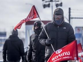 Unifor members walk the picket line outside of the Co-op Refinery Complex in Regina, SK on Monday, February 17, 2020.