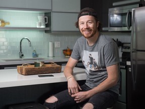 Mark Johnston, host of the afternoon show on the MY 92.1 radio station, sits in his home in Regina, Saskatchewan on Feb. 18, 2020.