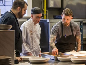 Chef Dale Mackay, right, discusses plating of the main course for the Juno Awards Gala with Ayden Restaurant corporate chef Benet Hunt, left, and Prairieland Park chef Eliot Lang. MacKay will be the Celebrity Chef of the Gala night on Saturday, March 14. Photo taken in Saskatoon, SK on Wednesday, February 19, 2020.