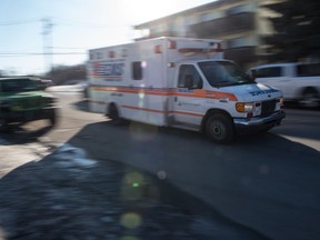 An ambulance drives down Angus Street in Regina, Saskatchewan on Feb 20, 2020.