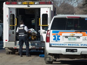 A paramedic unloads a stretcher during a call in the North Central neighbourhood in Regina, Saskatchewan on Feb 20, 2020.