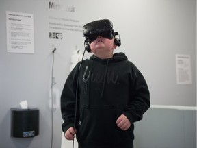 Exton McIntyre tries out one of the virtual reality stations at the Regina Public Library Central Branch in Regina, Saskatchewan on Feb. 21, 2020.