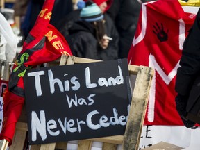 Community members gather along train tracks by 20th Street and Ave J in Saskatoon in solidarity with the Wet'suwet'en land protectors on Feb. 24, 2020.