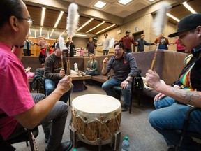 The Lone Creek drum group performs a song while students and visitors participate in a round dance around the outside of the pit in the Administration Humanities building at the University of Regina in Regina, Saskatchewan on Feb. 26, 2020. The event was designed to air Indigenous student concerns about the University of Regina's policies and approach to free speech.