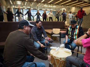 The Lone Creek drum group performs a song while students and visitors participate in a round dance around the outside of the pit in the Administration Humanities building at the University of Regina in Regina, Saskatchewan on Feb. 26, 2020. The event was designed to air Indigenous student concerns about the University of Regina's policies and approach to free speech.