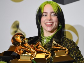US singer-songwriter Billie Eilish poses in the press room with the awards for Album Of The Year, Record Of The Year, Best New Artist, Song Of The Year and Best Pop Vocal Album during the 62nd Annual Grammy Awards on January 26, 2020, in Los Angeles.